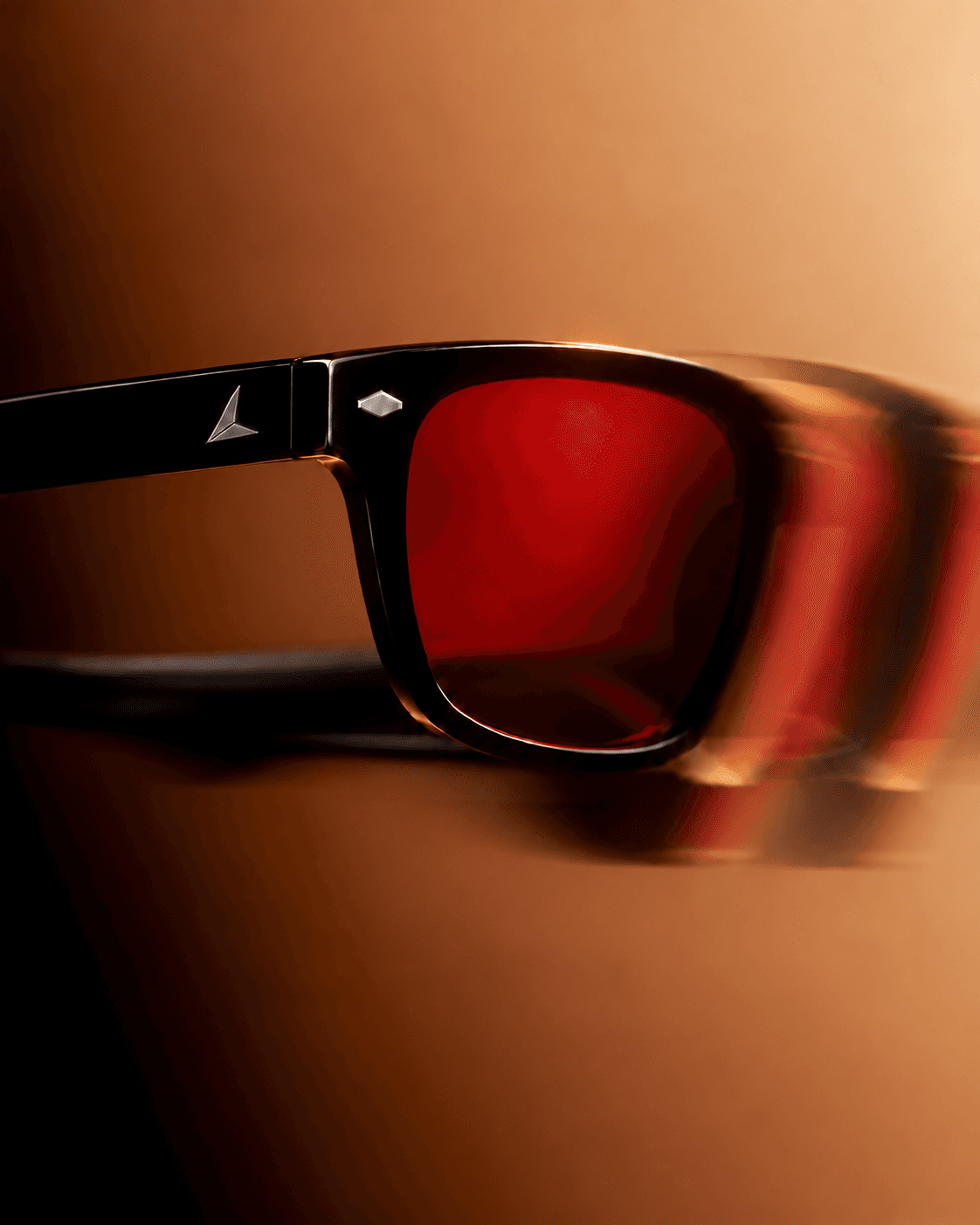 Crimson 01 in motion, temple mark sharp against a blurred sweep